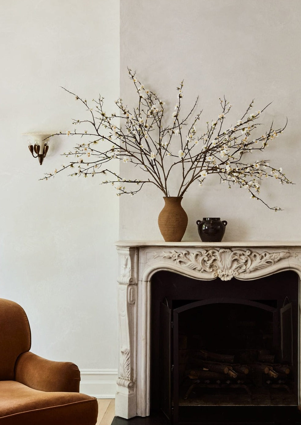 Quince Branch in Clay Vase