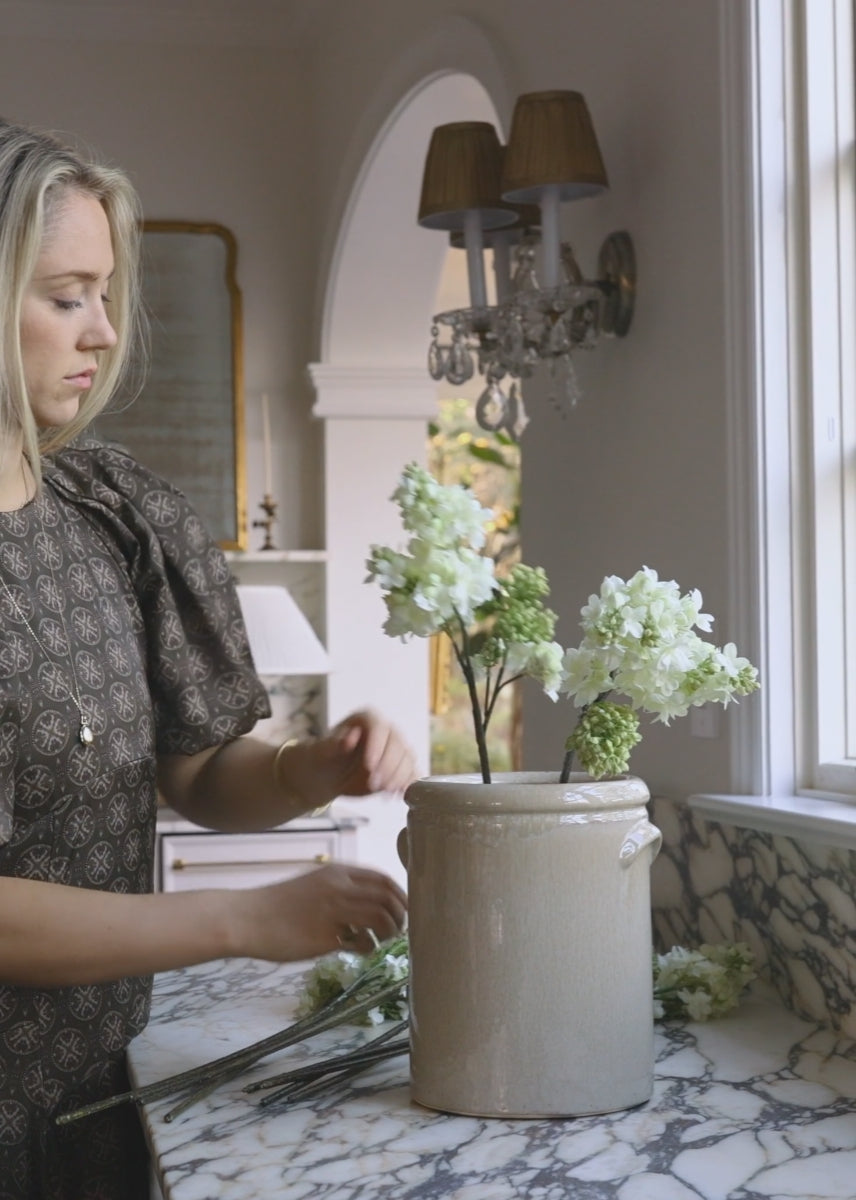 Artificial Spring Lilac Flowers in a Cream Crock Styled at afloral