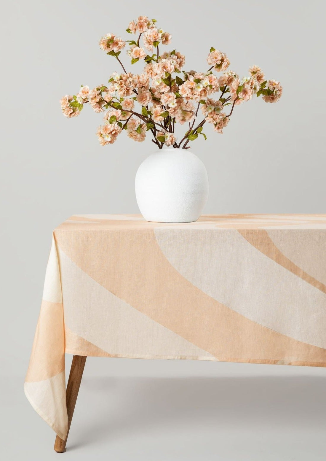 Linen Tablecloth in Sand with Artificial Peach Blossom Arrangement