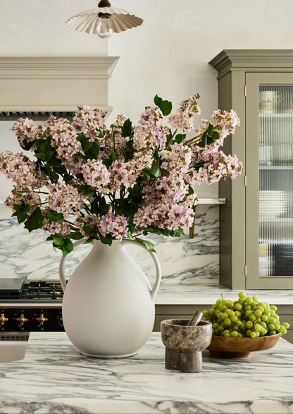 Pale Lavender Artificial Lilacs Styled in Double Handled Jug Vase at afloral